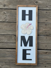 HOME with hibiscus sign