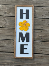 HOME with hibiscus sign