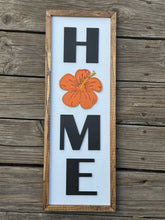 HOME with hibiscus sign